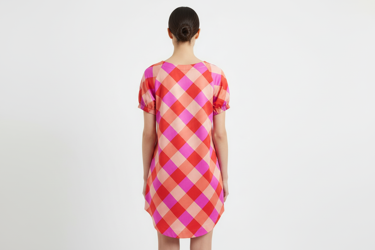 Plaid dress with red and pink pattern on a white background